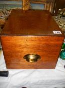 A vintage oak filing drawer.