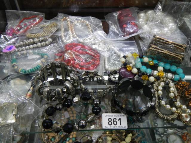 Approximately twenty bracelets etc.,