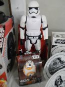 A boxed Star Wars stormtrooper with blaster and a boxed Star Wars BB-8 Droid.