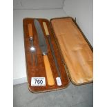 A vintage cased carving set.