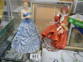 Two Royal Doulton figures - 'Top O' The Hill' and 'March'.