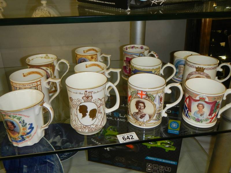 A quantity of commemorative mugs including Royalty.