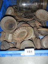 A large quantity of vintage tin cake moulds.