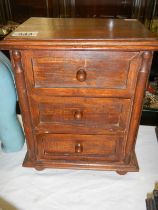 A small mahogany three drawer chest. COLLECT ONLY.