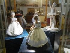 Three boxed hand painted porcelain figures including a ballerina.