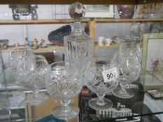 A crystal decanter and six brandy glasses. COLLECT ONLY.