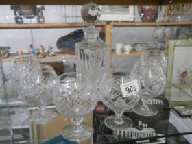 A crystal decanter and six brandy glasses. COLLECT ONLY.