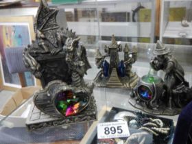 Three pewter gemstone figures.