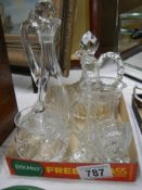 A cut glass milk jug, sugar bowl, oil bottle etc.,