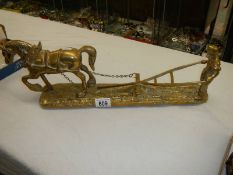 A large solid brass figure of a working horse and ploughman, length 50 cm.