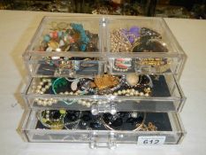 A case of assorted costume jewellery.