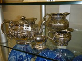 Four pieces of Ridgway silver lustre including teapot, cream jug, water jug and salt pot, c 1820-25.