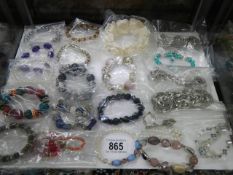 Approximately twenty bracelets
