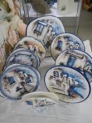 A collection of handpainted and signed Greek town scene plates.