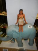 A large painted wooden elephant with a figure on its back, height 40 cm, length 39 cm, COLLECT ONLY