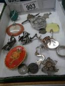 A mixed lot of brooches, pendants etc.,