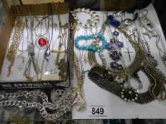 A mixed lot of necklaces etc.,