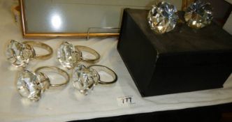 A set of six napkin ring in the form of diamond solitaire rings.