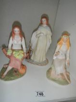 Three porcelain seasons figures - Spring, Autumn and Winter.