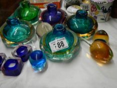 A quantity of studio glass bud vases etc.,
