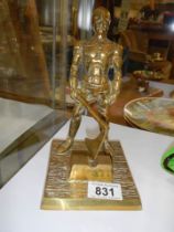 A solid brass figure of an executioner..