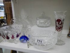 A decorative vase, cut glass and one other.