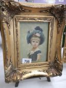 An ornate gilt framed study of a child, frame 25 x 30 cm, image 11.5 x 17cm. COLLECT ONLY.