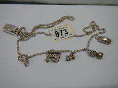 A hall marked silver charm bracelet with charms.