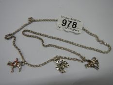 A hall marked silver neck chain with horse charms.
