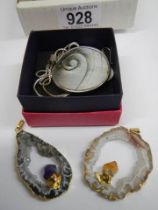 Two agate goede gemstone pendants and another necklace with earrings.