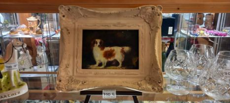 A framed picture of a Spaniel