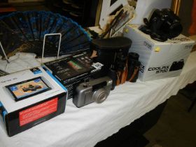 A boxed Nikon camera, a boxed Satnav, binoculars etc.,