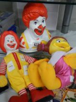 A Ronald McDonald money box & two Mcdonald figures (plastic head and soft body) from '97 collection.