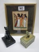 An Egyptian picture and two Egyptian God Bastet items.