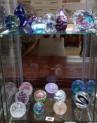 A collection of paperweights including Caithness