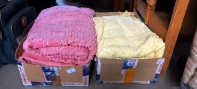 A double pink candlewick bedspread and a single yellow candlewick bedspread
