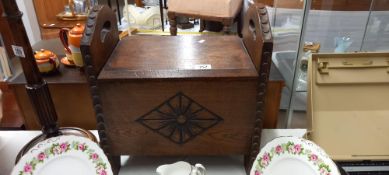 A hinged oak carved storage box/stool COLLECT ONLY