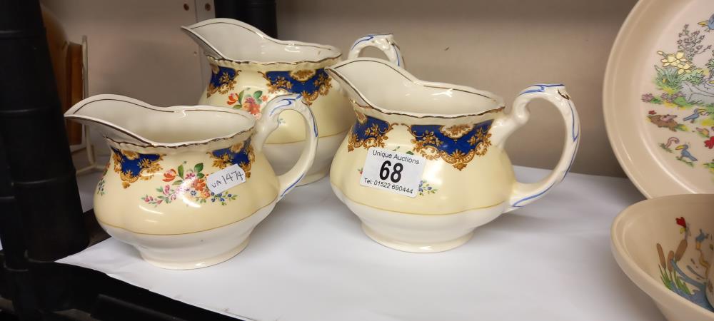 3 vintage graduated jugs by Grindley