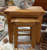 A pair of solid oak nest of tables (height of largest table 50cm) COLLECT ONLY