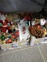 Two boxes of assorted Christmas decorations.