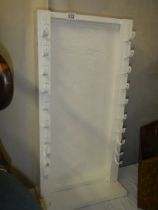 A sword/musket display stand with six slots. COLLECT ONLY.