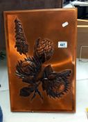 A copper sheet repousse art work framed picture of flowers