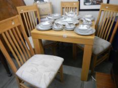 A good quality oak dining table with four chairs, COLLECT ONLY.