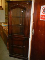 An oak corner cabinet, COLLECT ONLY.