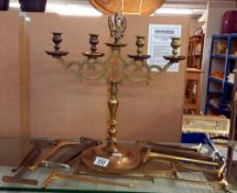 A brass candelabra and 7 pairs of brass shelf brackets