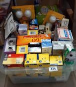 A box of light bulbs and adapters/plugs