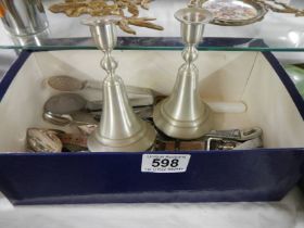 A mixed lot of cutlery and a pair of Dutch style candlesticks.