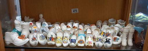 A good mixed lot of porcelain boots and shoes including crested examples. COLLECT ONLY