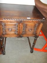 An oak cabinet with two deep drawers, COLLECT ONLY.