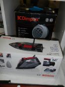 A new boxed Bosch DA20 electric iron and a boxed Dimplex fan heater.